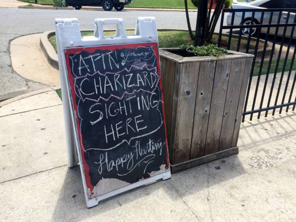 A sign on the patio at Sauced on Paseo alerts customers to the type of Pokemon seen at the restaurant. Businesses are taking advantage of mechanisms within the "Pokemon Go" game to attract customers. Photo by Jesse Pound, The Oklahoman